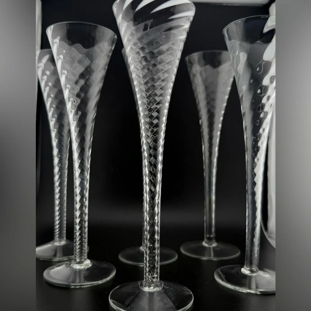 7 Crate & Barrel “Renoir” hollow stemmed champagne flutes. 6oz 10”H